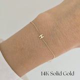 Model wearing the 14K Just Initial Bracelet solo on wrist