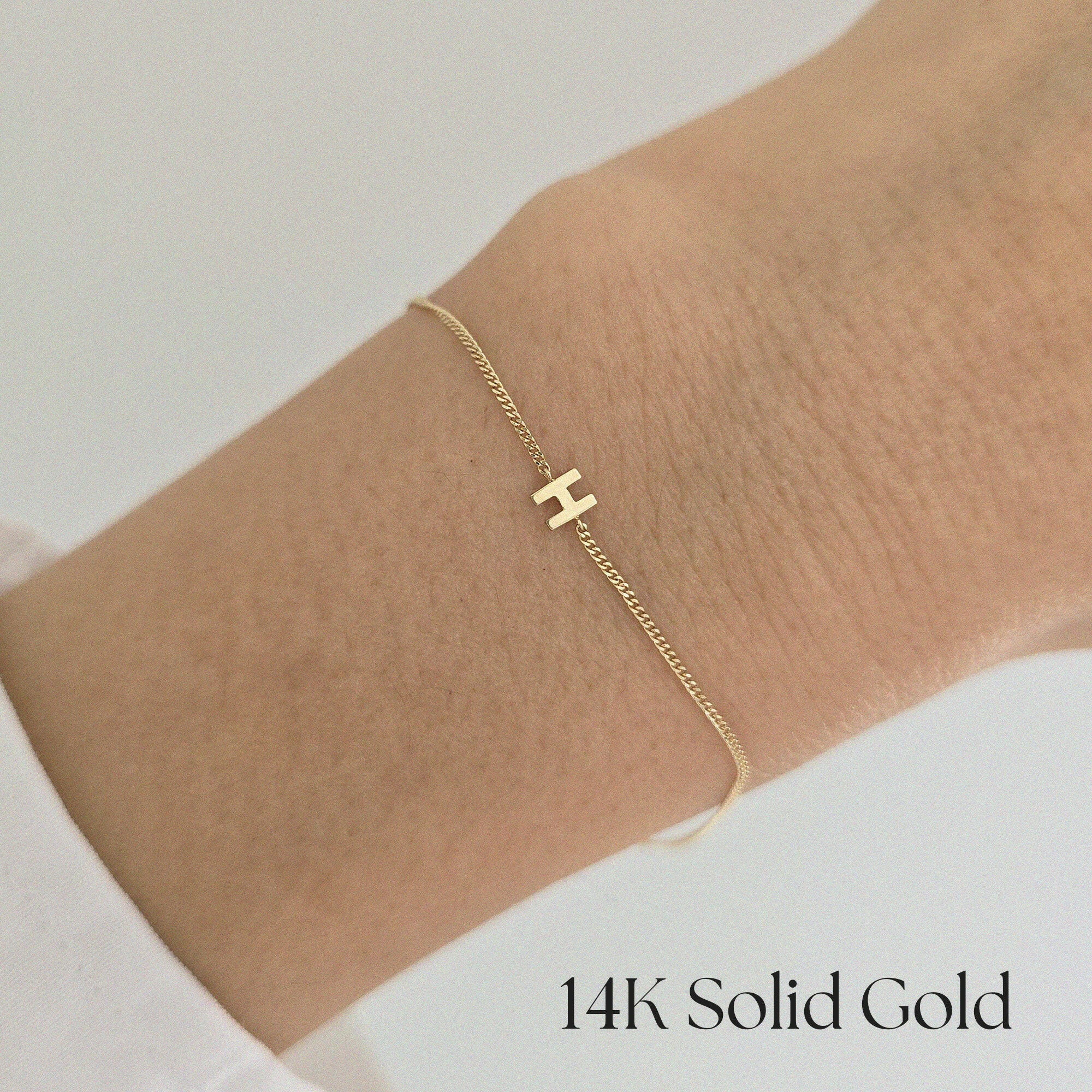 Model wearing the 14K Just Initial Bracelet solo on wrist