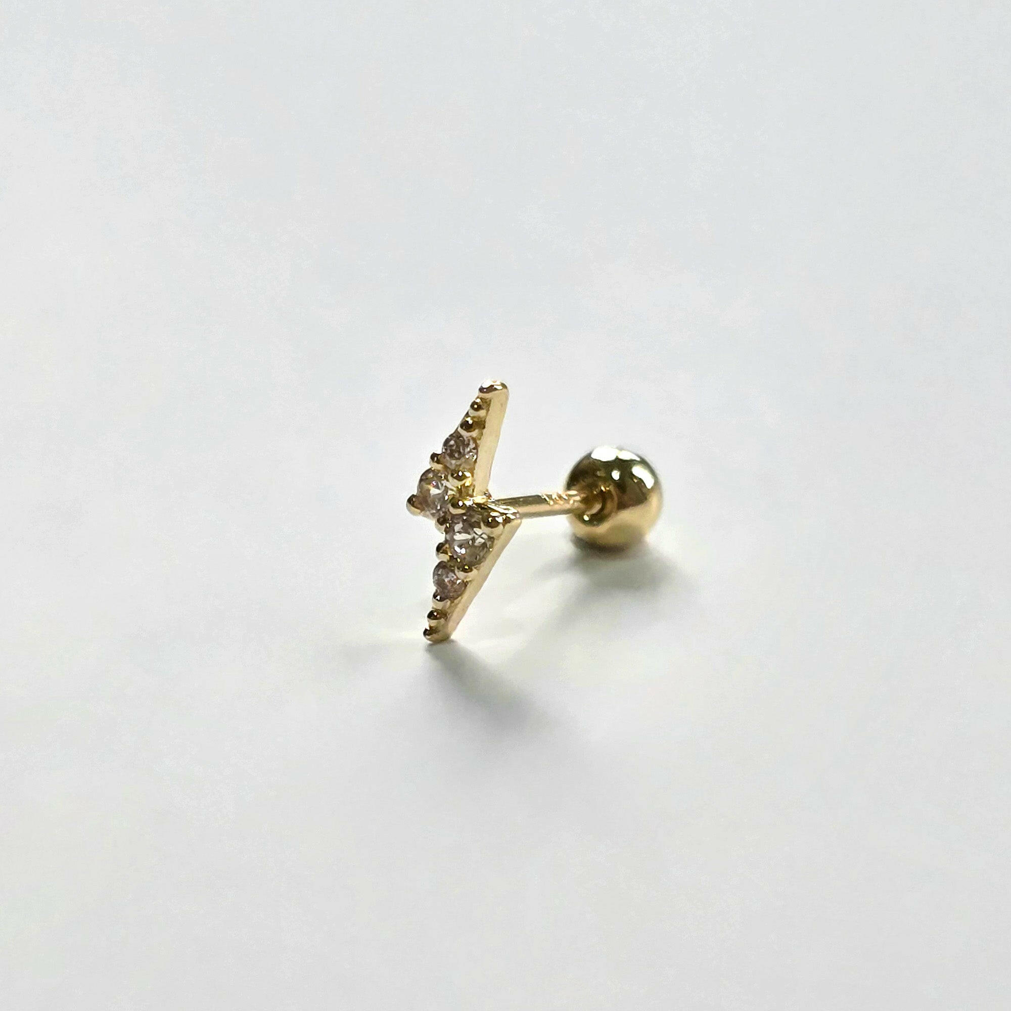 Lightning bolt cartilage earring viewed from side profile
