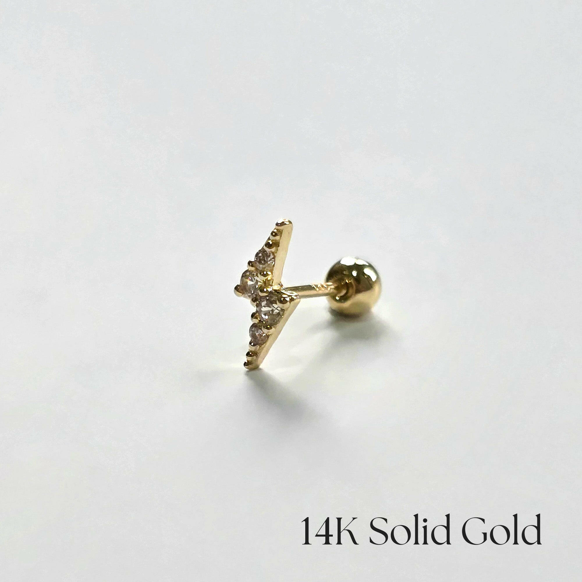Side close-up of the Lightning bolt cartilage earring on white background