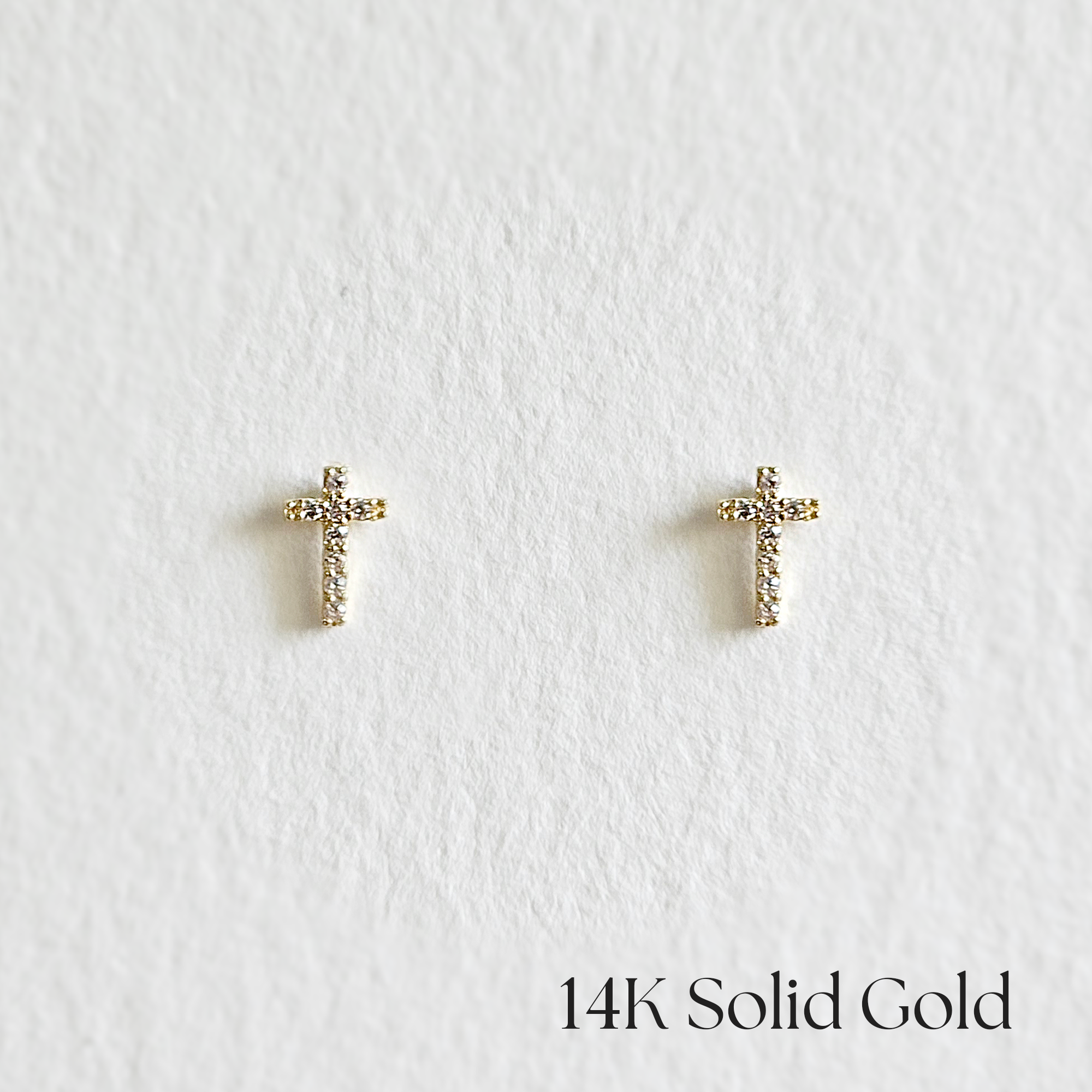 Crystal cross stud earrings photographed from front