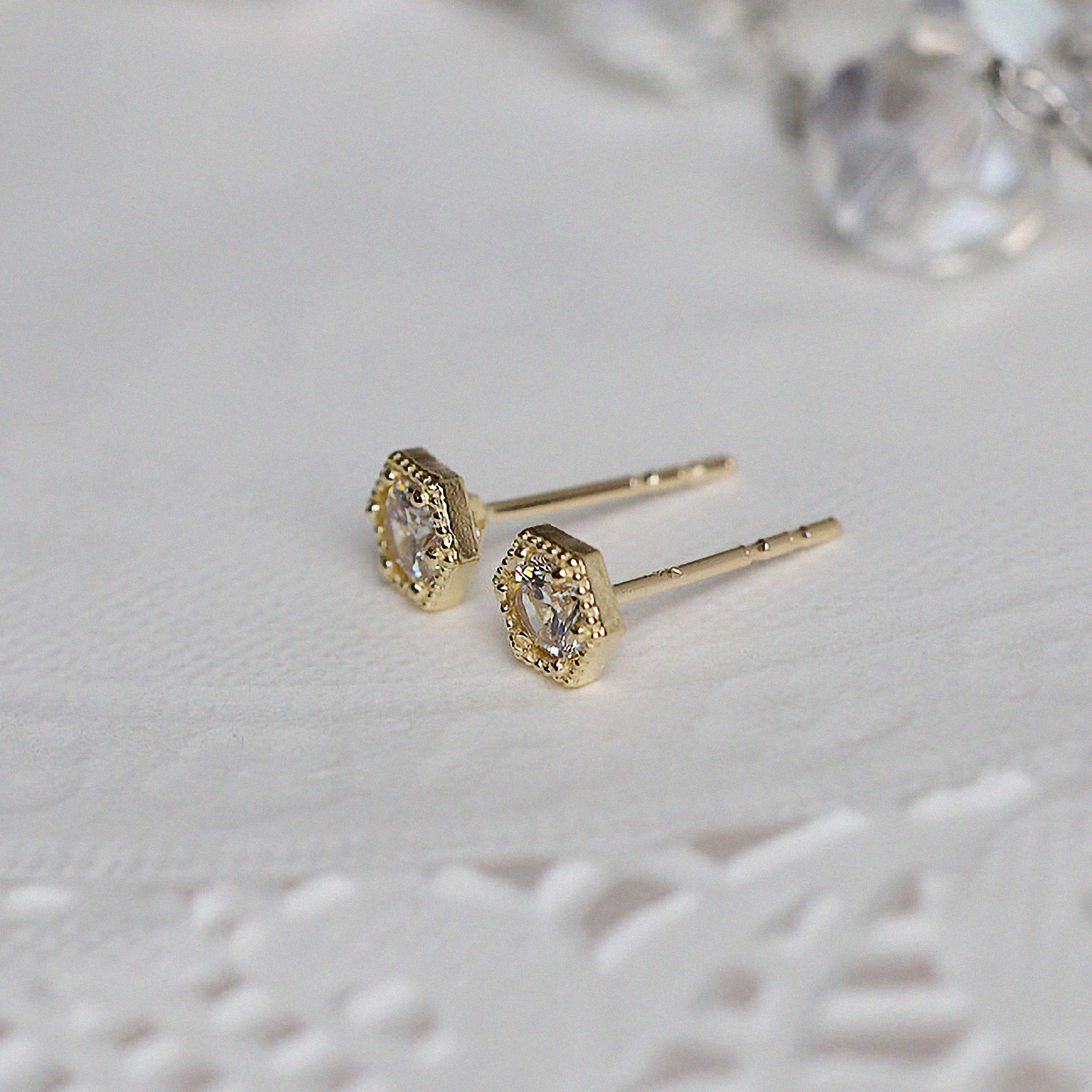 Side profile of hexagon earrings showing frame and depth
