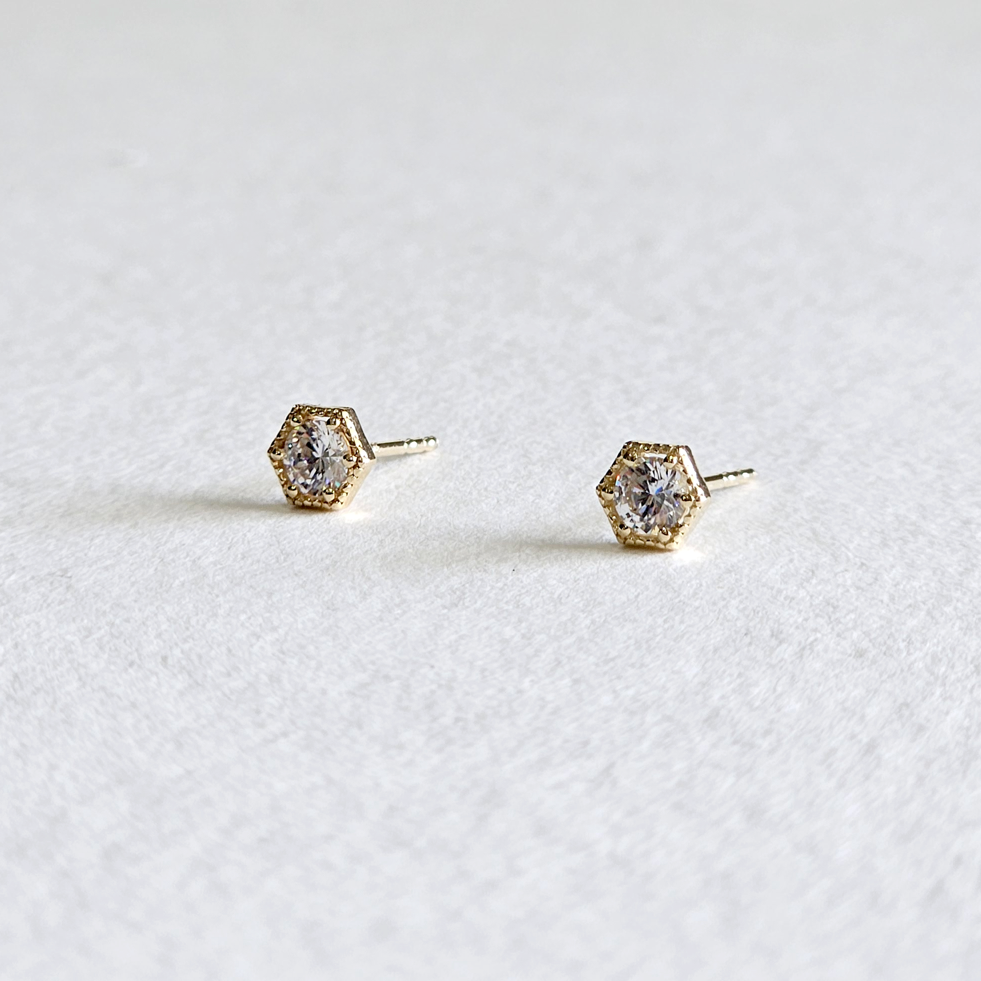 Side profile of hexagon earrings showing frame and depth