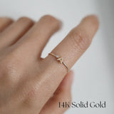 Model wearing 14K Initial 'A' Ring solo on finger with subtle diamond sparkle