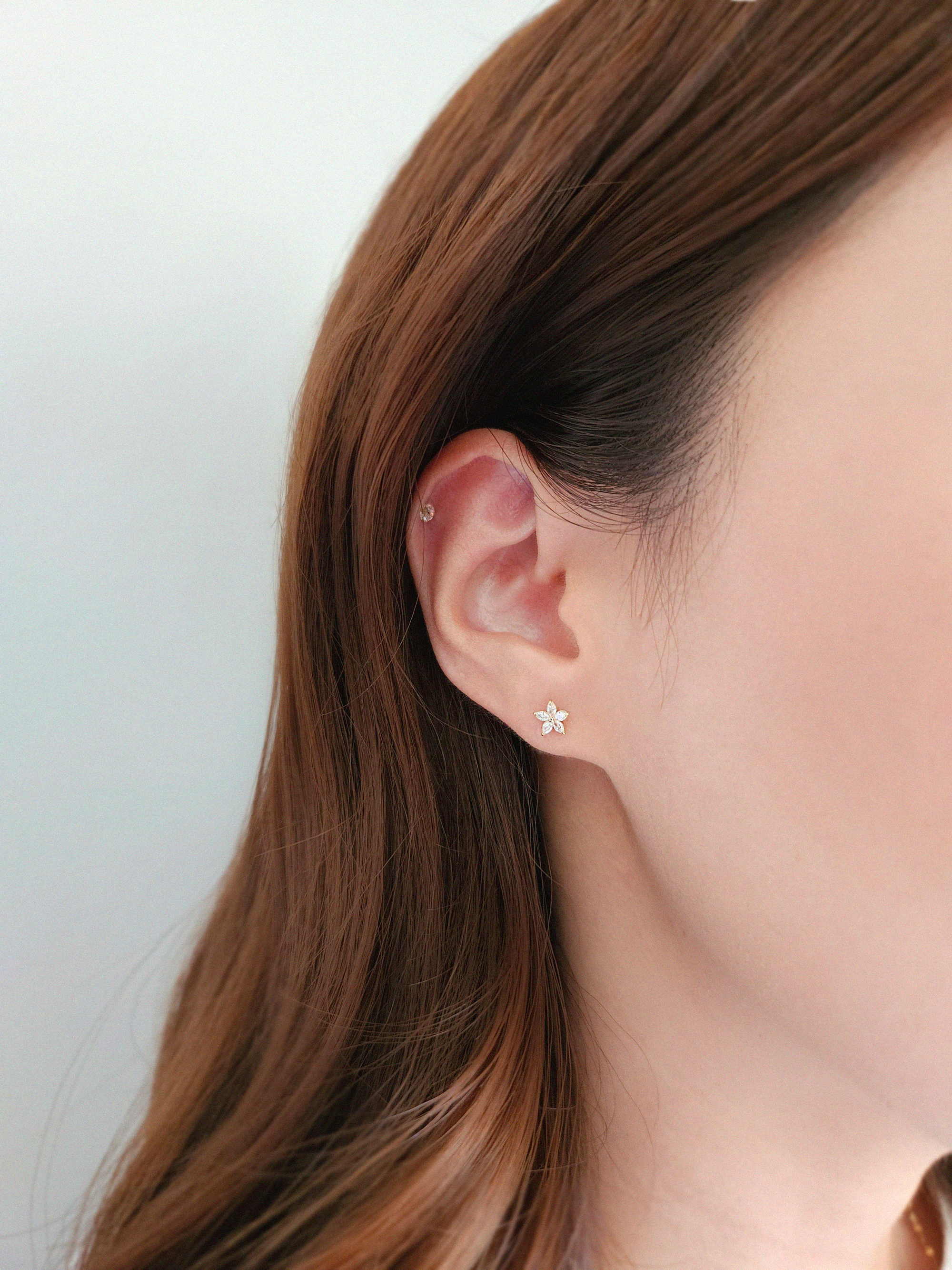 14K gold flower earrings styled alone for a delicate shine
