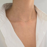 Model wearing Laondrim 14K initial necklace – dainty gold chain with diamond charm