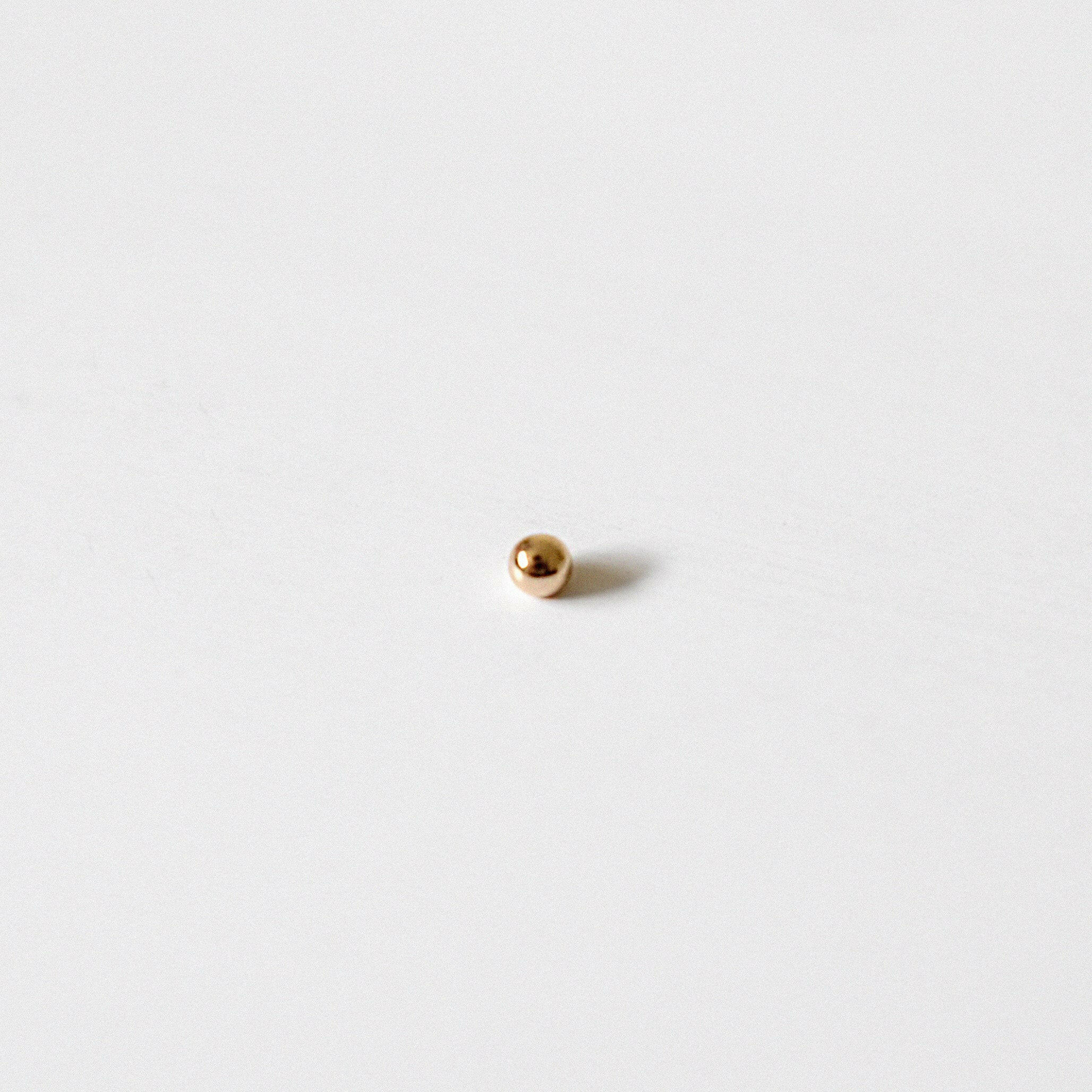 Detailed close-up of 2.9mm diameter 14K gold earring back