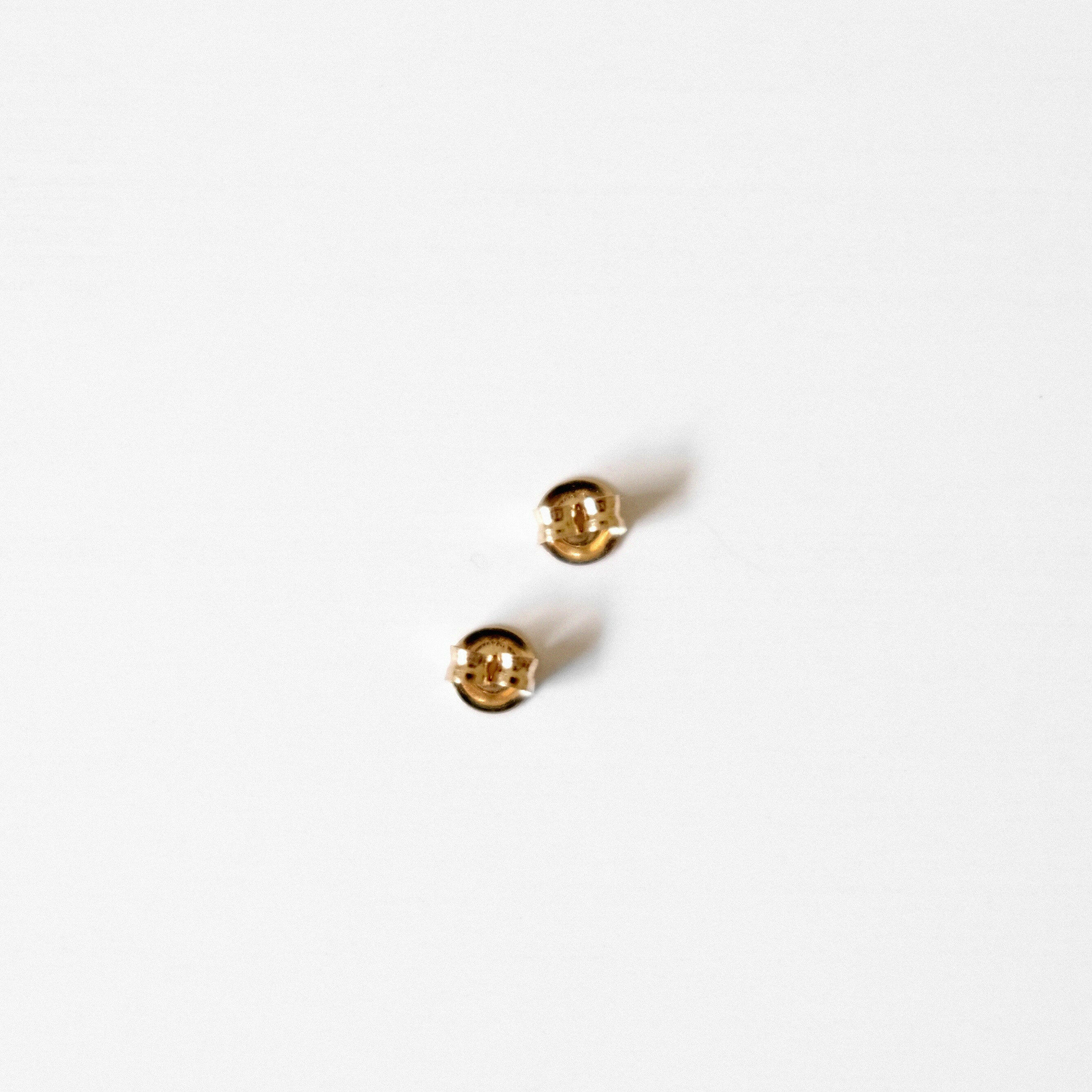 Pair of 14K gold clutch backs for secure and comfortable stud fastening