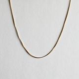 Box chain necklace laid flat with uniform square links
