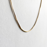 Close-up of gold filled box chain texture