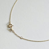 Detail view of slim 14K gold chain and clasp on Petite Crystal Necklace