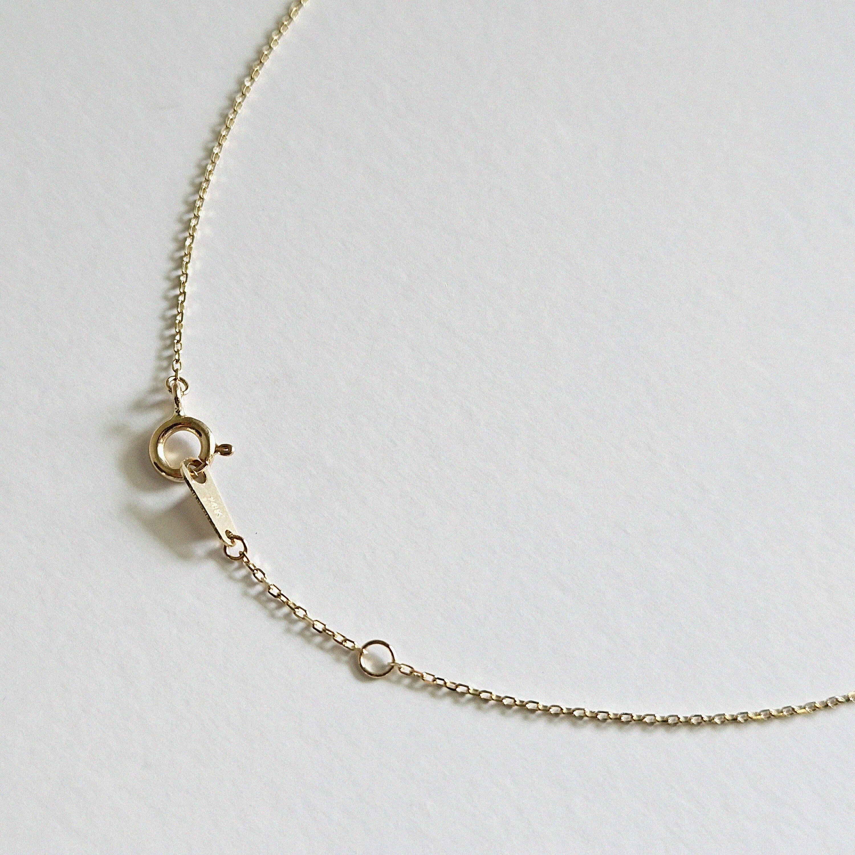 Detail view of slim 14K gold chain and clasp on Petite Crystal Necklace