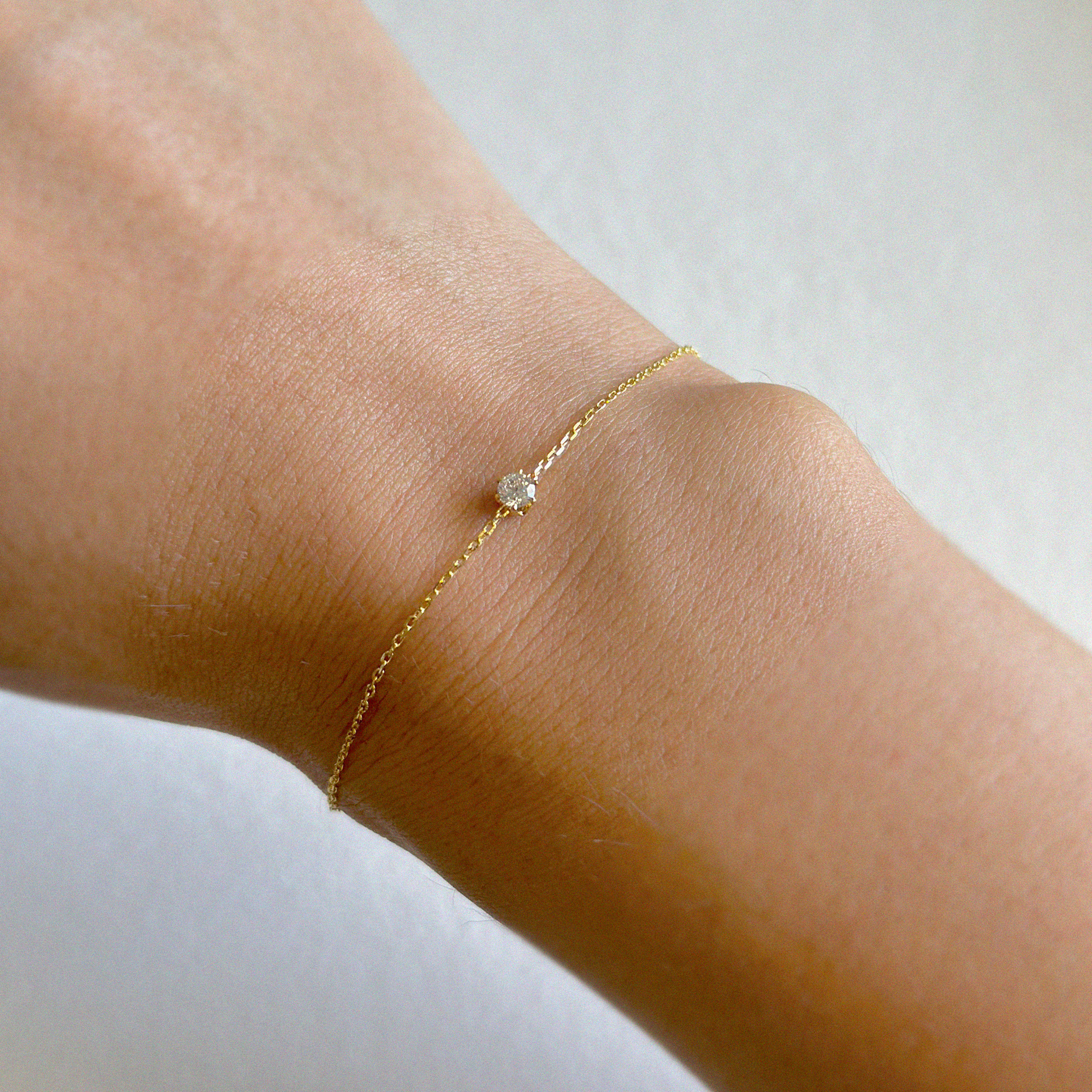 Elegant crystal bracelet featuring a dainty chain with 3mm cubic zirconia stone accents, perfect for sophisticated style