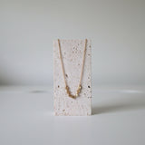 Necklace on stone stand