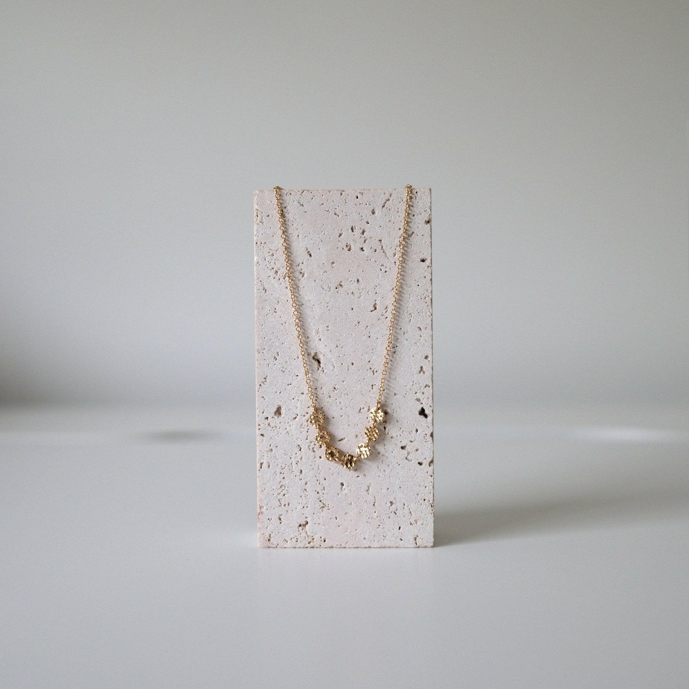 Necklace on stone stand