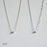 Single pearl necklace exemplifying elegant minimalism, perfect for timeless and sophisticated style.