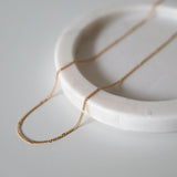 Close-up of fine chain links showing subtle shine