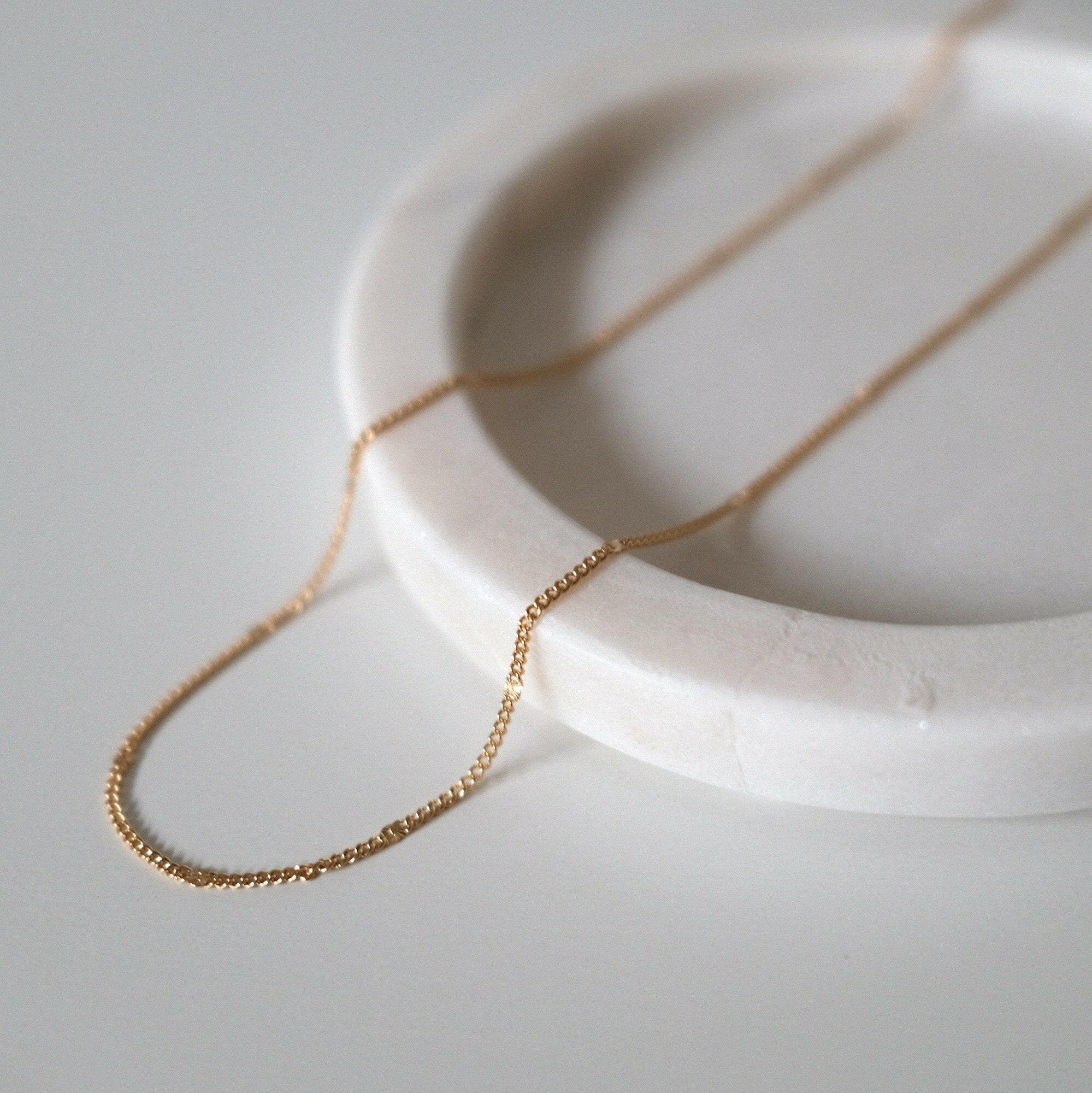Close-up of fine chain links showing subtle shine