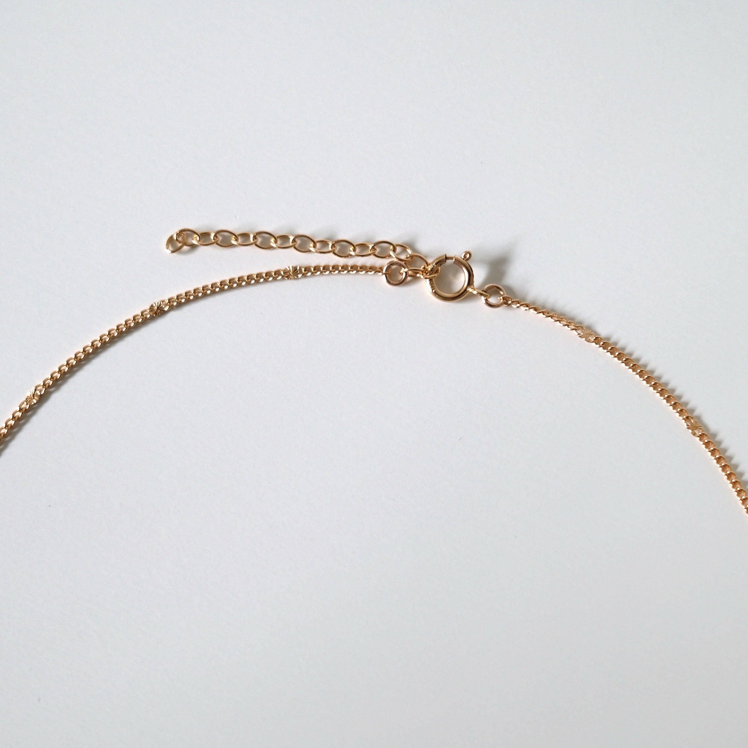 Chain detail shot highlighting smooth texture and craftsmanship