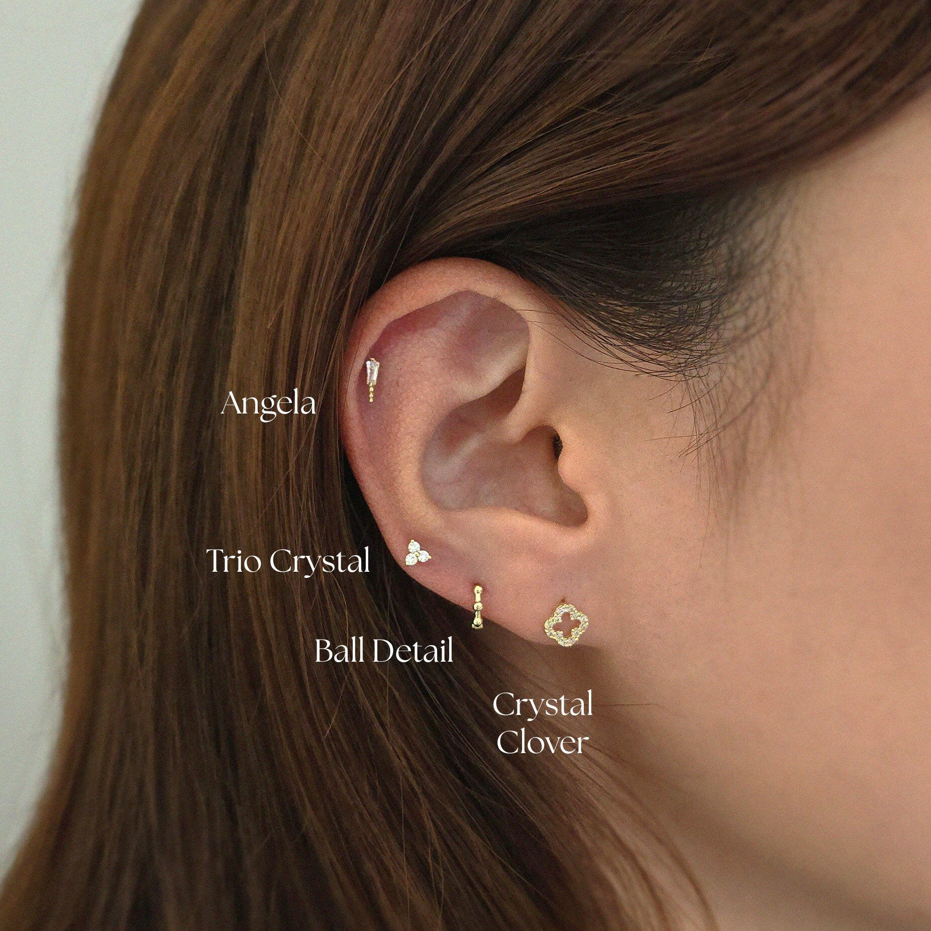 Angela Cartilage Earring layered with small cartilages for a curated ear look