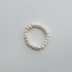 Elegant freshwater pearl beaded stretchy ring showcasing delicate craftsmanship in a stylish beaded design