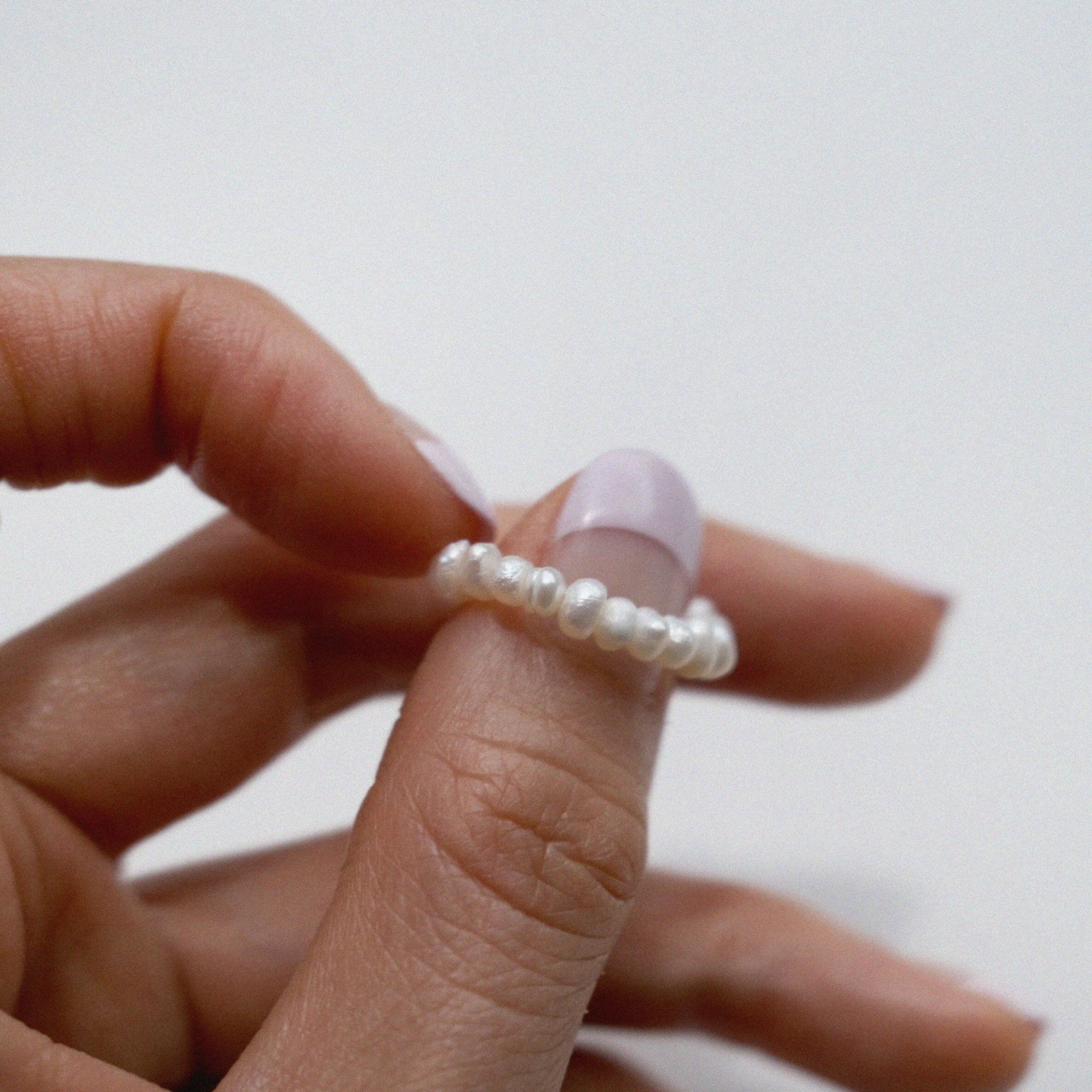 Elegant freshwater pearl beaded stretchy ring showcasing delicate craftsmanship in a stylish beaded design