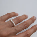 Elegant freshwater pearl beaded stretchy ring showcasing delicate craftsmanship in a stylish beaded design