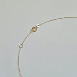 Clasp and extender of pearl necklace shown in secure, polished finish