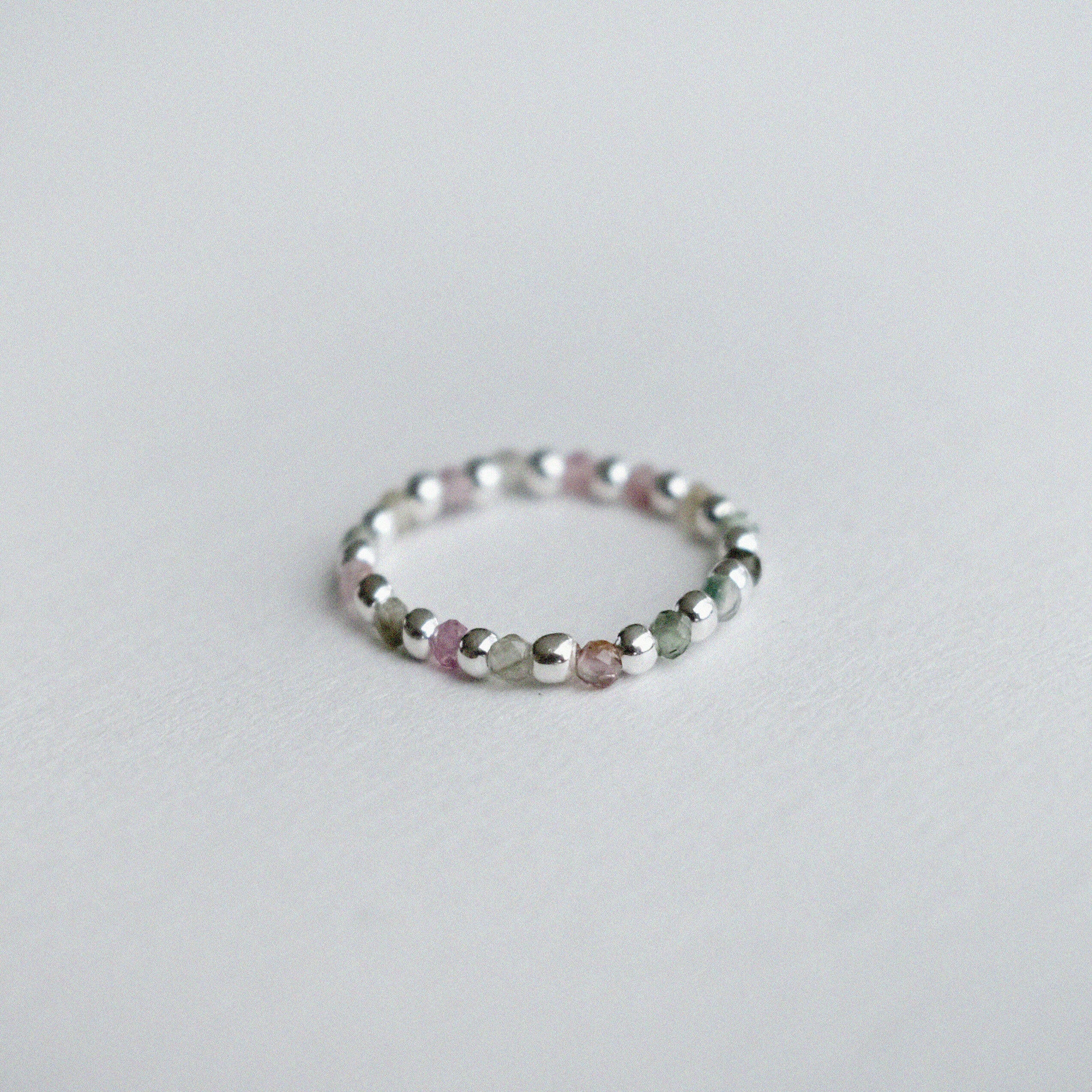 Elegant Bari beads ring with silver bead balls, colorful stones, stretchy design, and handmade craftsmanship