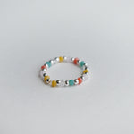 Elegant Bari beads ring with silver bead balls, colorful stones, stretchy design, and handmade craftsmanship