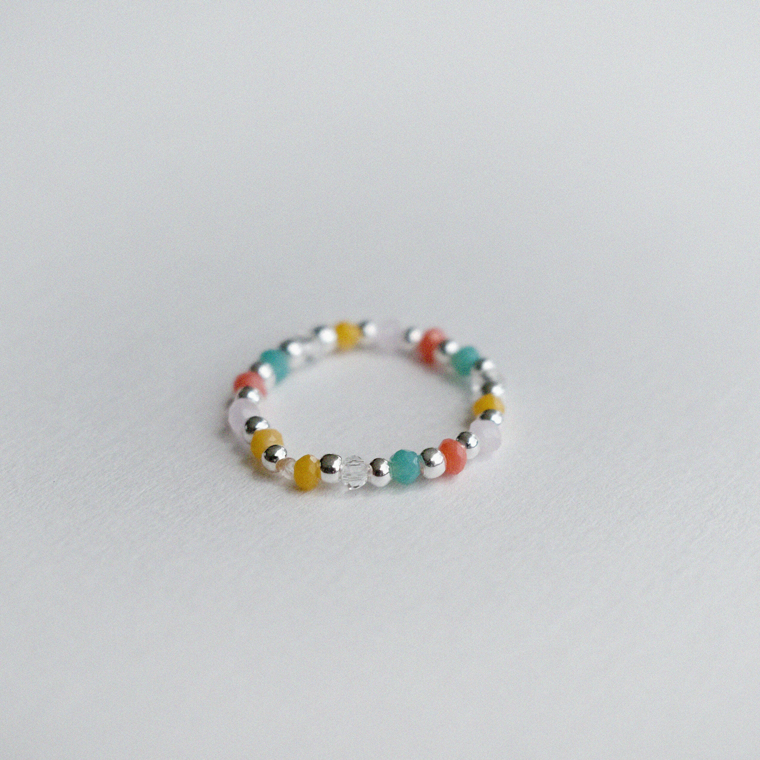 Elegant Bari beads ring with silver bead balls, colorful stones, stretchy design, and handmade craftsmanship