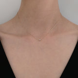 Model shot showcasing the necklace’s petite elegance on skin