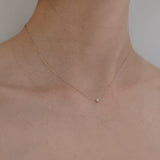 Model wearing Bella Luce Necklace – sparkling zirconia rests near collarbone