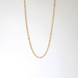 Elongated link gold filled chain necklace laid flat