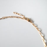 Close-up of lobster clasp attached to a middle link for custom fit