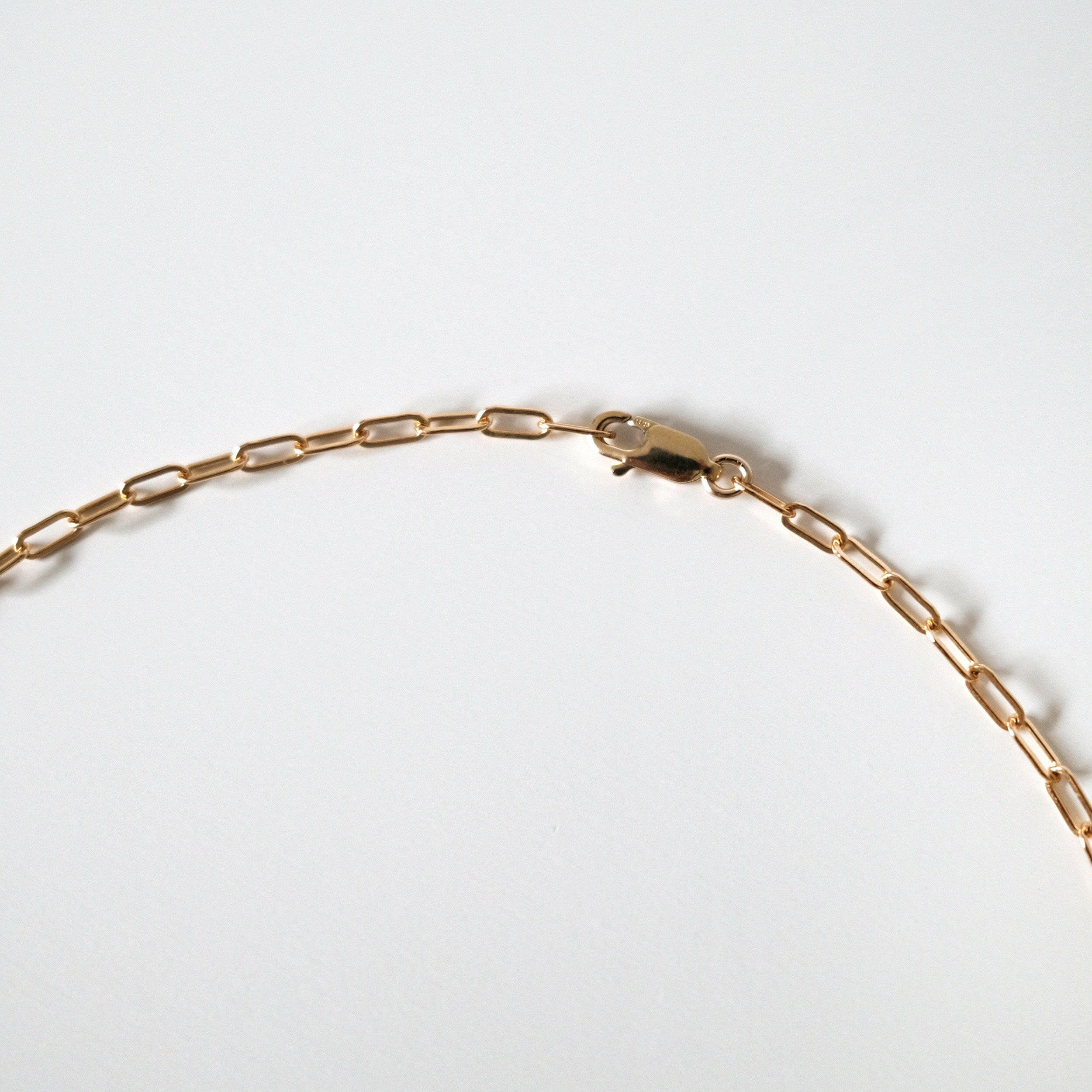 Side angle showing chain links and clasp durability