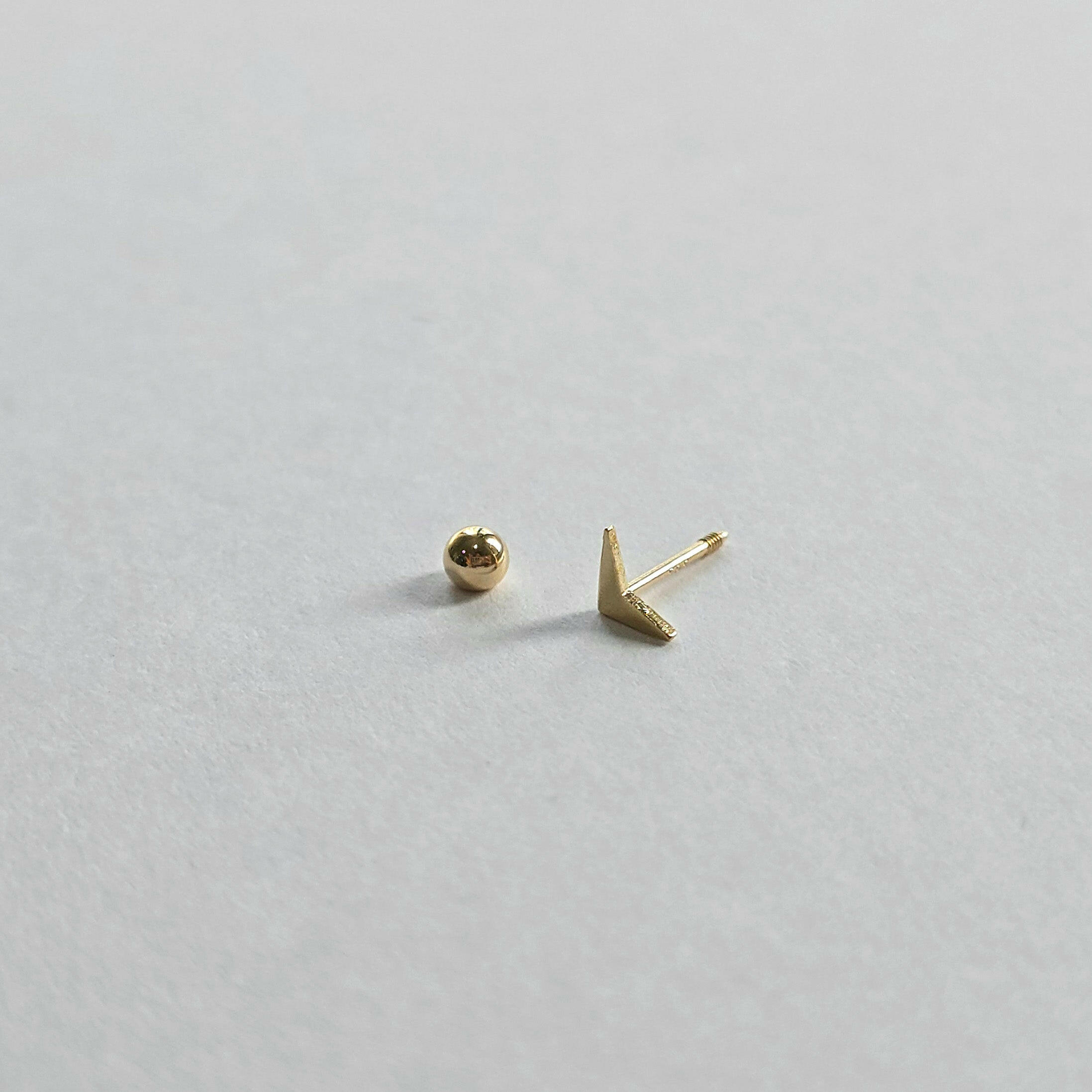 Screwball back detail and 14K triangle cartilage earring for secure fit