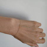 14K gold bracelet with modern curved design styled for everyday elegance