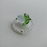 Handmade floral beaded ring featuring tulip flower centerpiece, and clear stones for elegant style