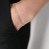 Sicily Chain Bracelet layered on wrist for a refined look, paired with classic black clothing