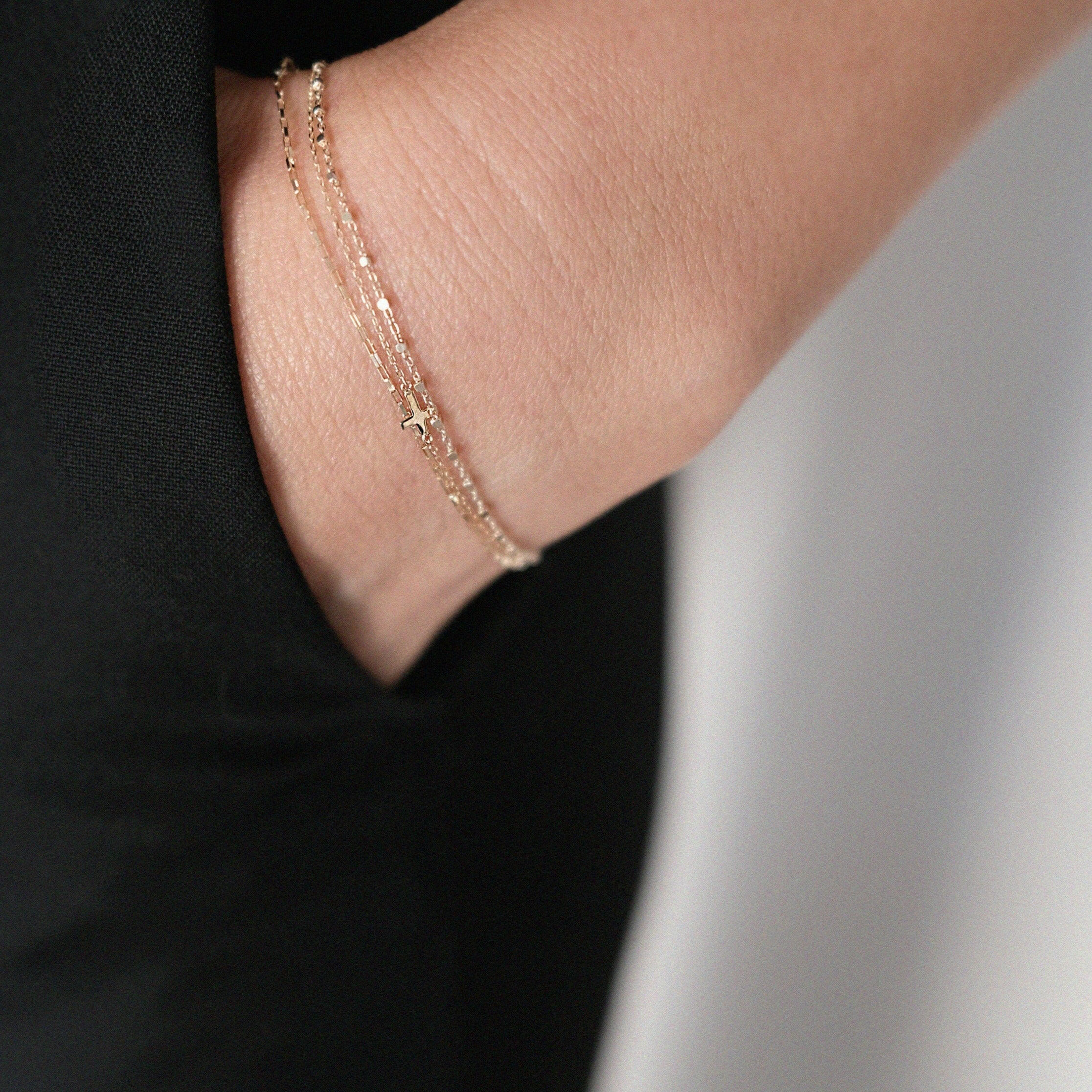Sicily Chain Bracelet layered on wrist for a refined look, paired with classic black clothing