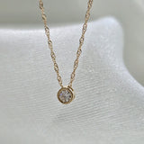 14K solid gold crystal accent necklace, top view showing cubic zirconia sparkle