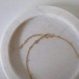 Spring ring clasp detail showing secure and delicate closure
