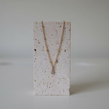 Stone stand display of necklace chain curve and center crystal