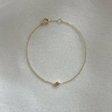 14K Diamond Accent Bracelet with central 3mm diamond pendant displayed flat on white background