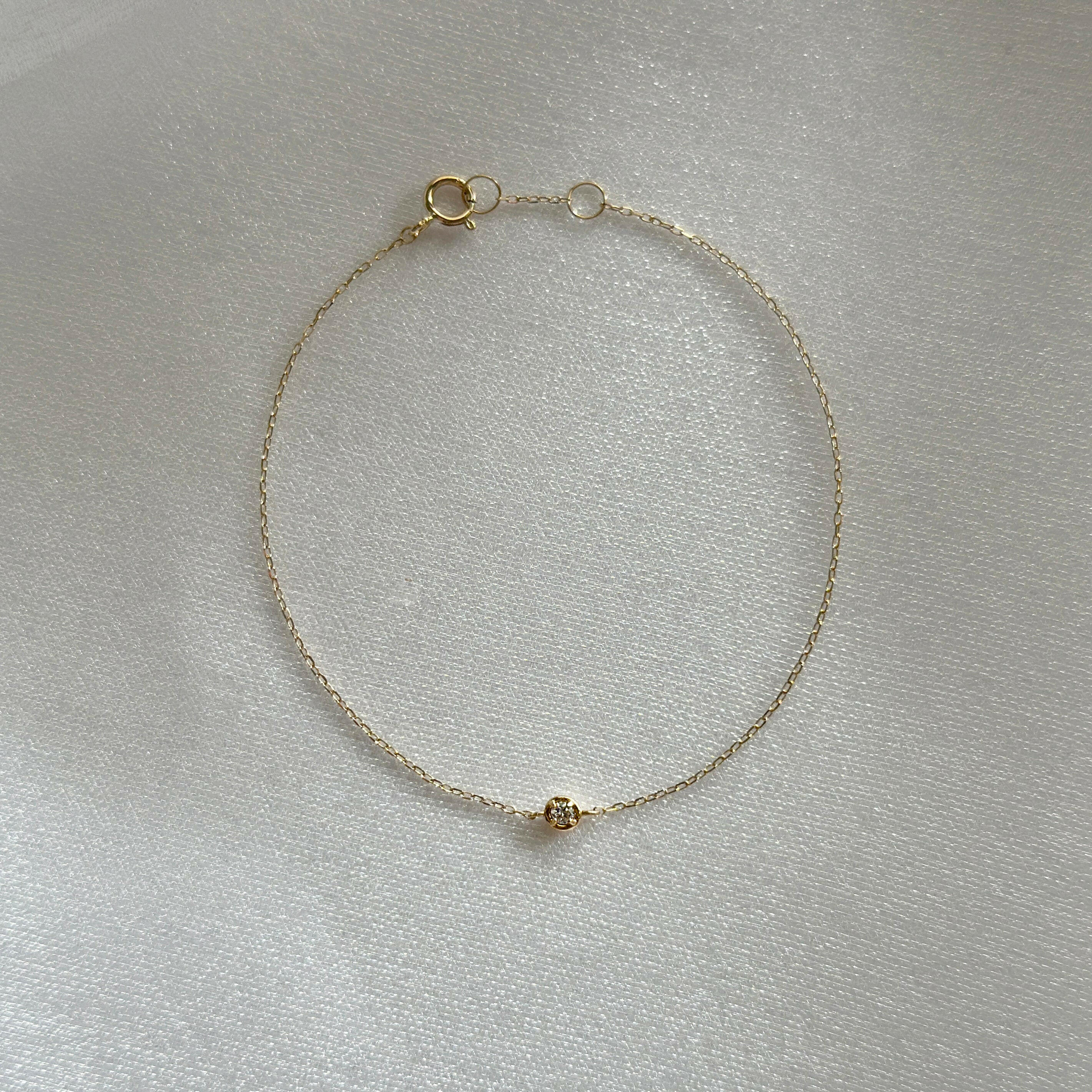 14K Diamond Accent Bracelet with central 3mm diamond pendant displayed flat on white background