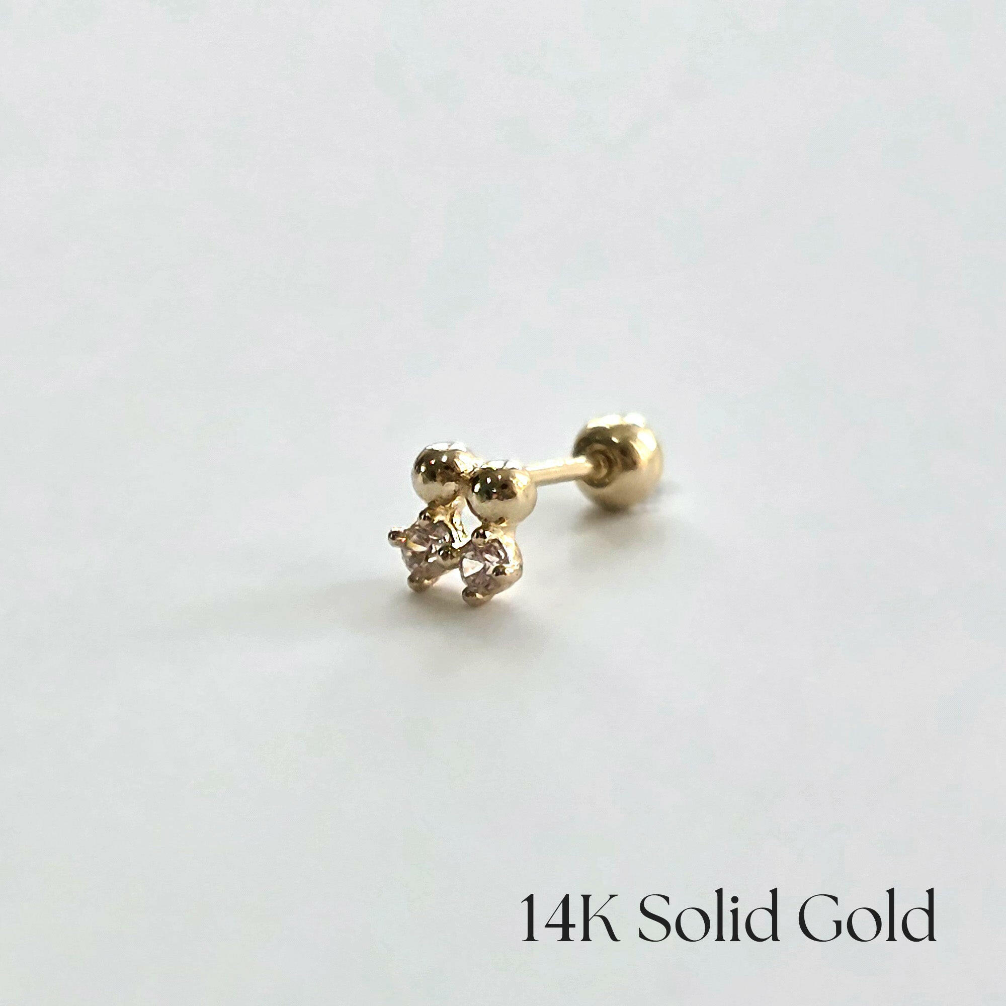 Side close-up showing the 14K Crystal Twin Cartilage Earring on white background