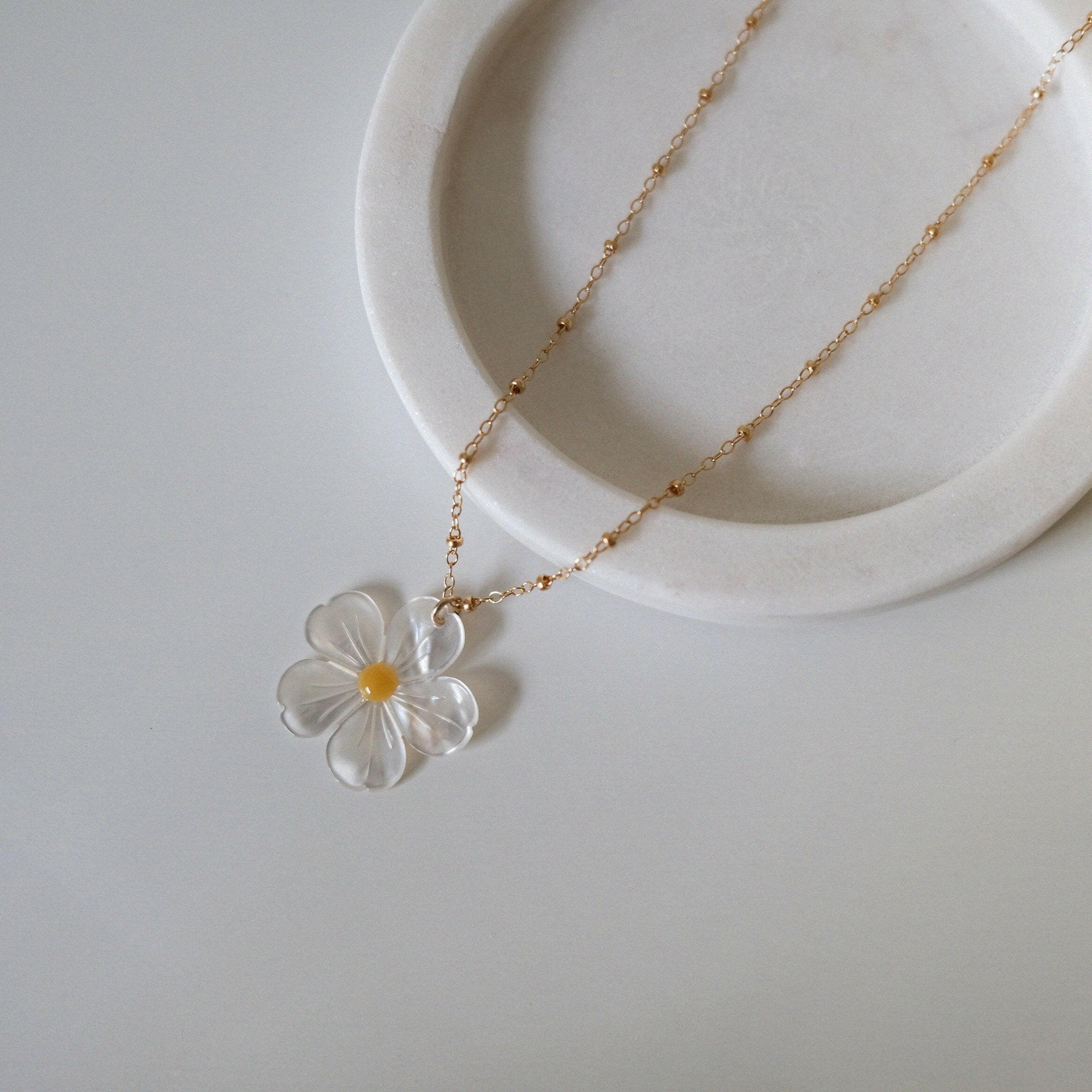Ultra close-up of mother of pearl daisy texture and shine