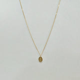 Front-facing image of Dear Initial Necklace showing full chain and oval pendant – minimalist and timeless in 14K gold
