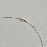 Spring clasp detail of the 14K Dear Initial Necklace showing secure fastening